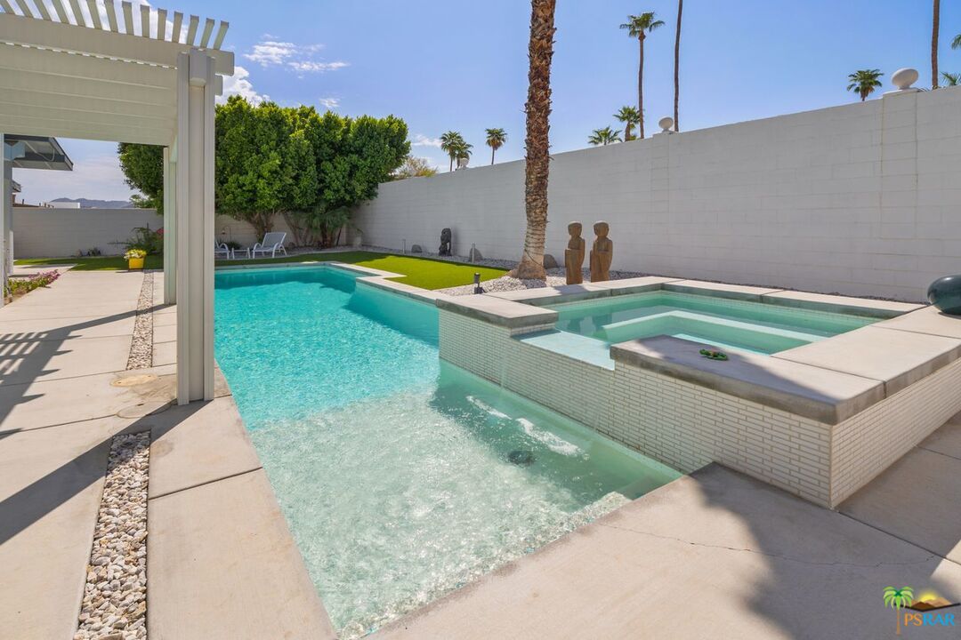 73501 Silver Moon Trail Palm Desert, CA 92260 - Photo 38 of 38 a view of a swimming pool with a yard