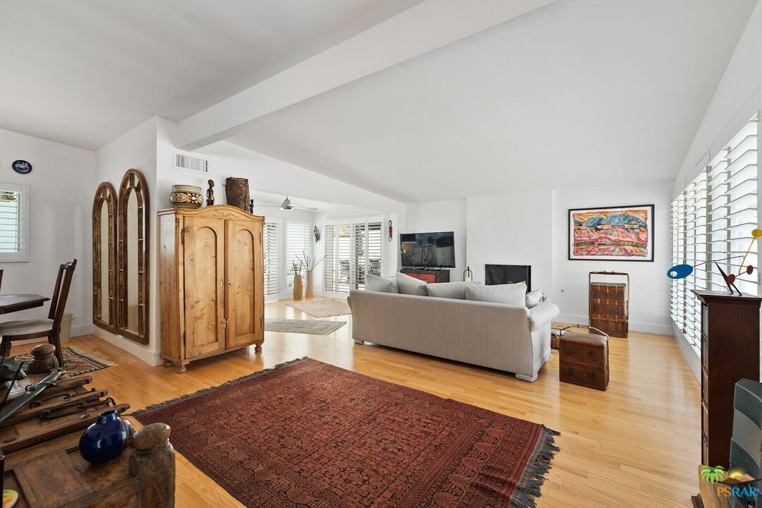 73501 Silver Moon Trail Palm Desert, CA 92260 - Photo 6 of 38 a living room with furniture and a flat screen tv