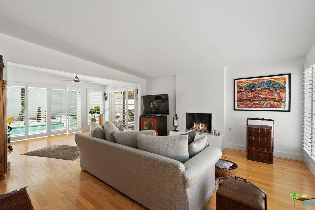 73501 Silver Moon Trail Palm Desert, CA 92260 - Photo 7 of 38 a living room with furniture and a flat screen tv