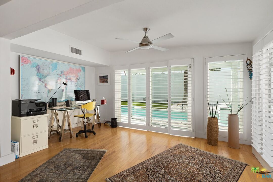 73501 Silver Moon Trail Palm Desert, CA 92260 - Photo 9 of 38 a living room with furniture and a large window