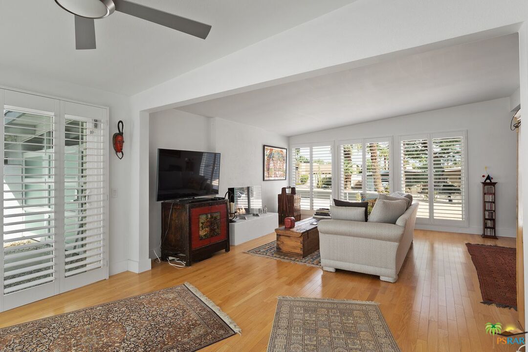 73501 Silver Moon Trail Palm Desert, CA 92260 - Photo 10 of 38 a living room with furniture and a flat screen tv