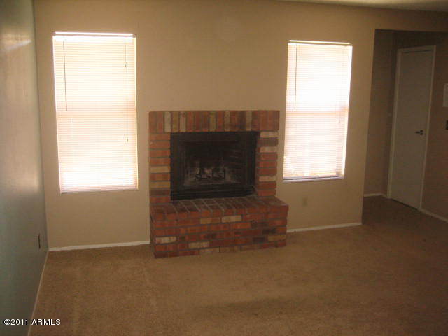 3511 East Baseline Road, Unit 1217 Phoenix, AZ 85042 - Photo 3 of 18 Family Room & Fireplace
