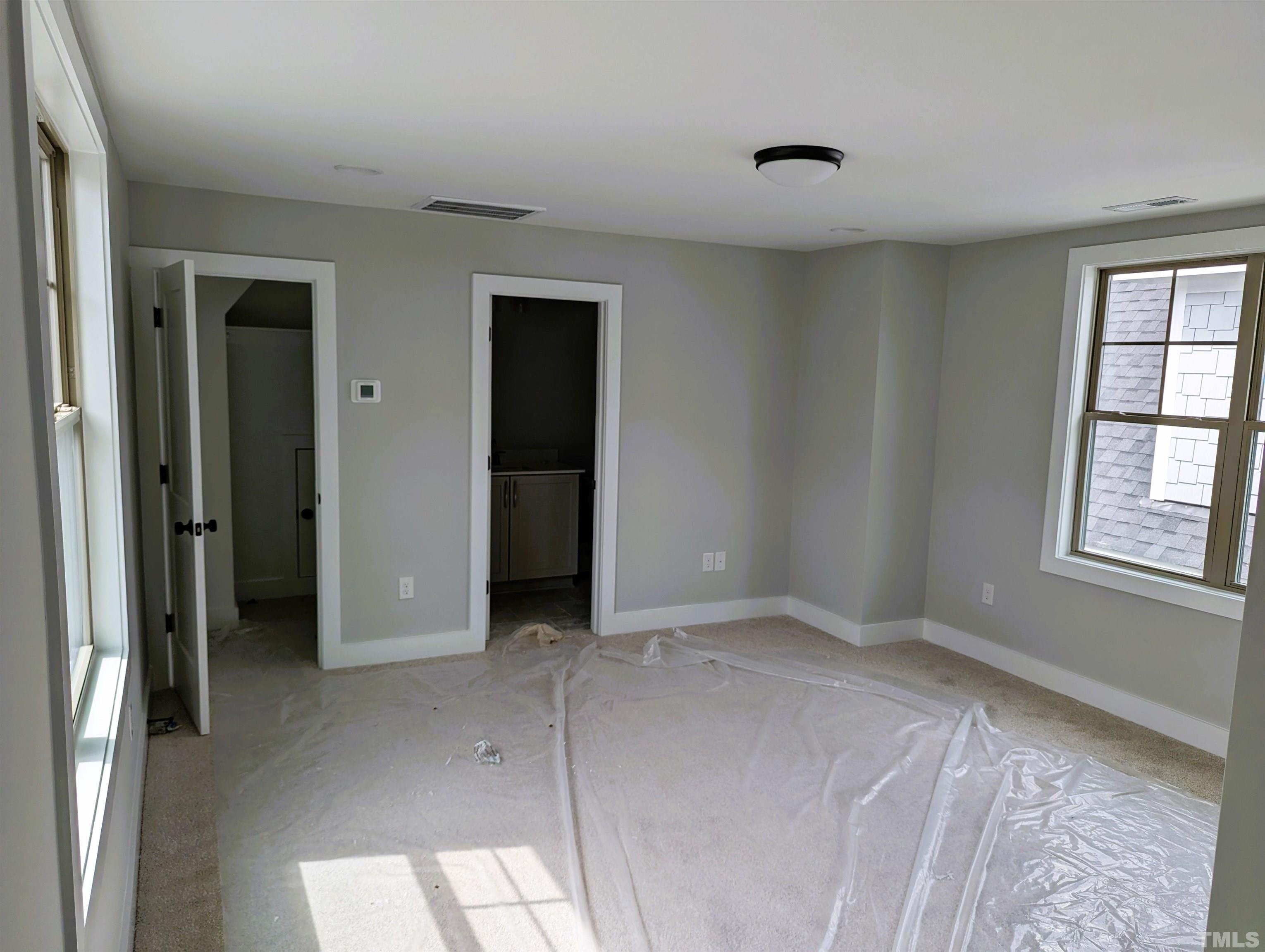 200 East Moore Street Apex, NC 27502 - Photo 12 of 19 a view of an empty room with window and closet area