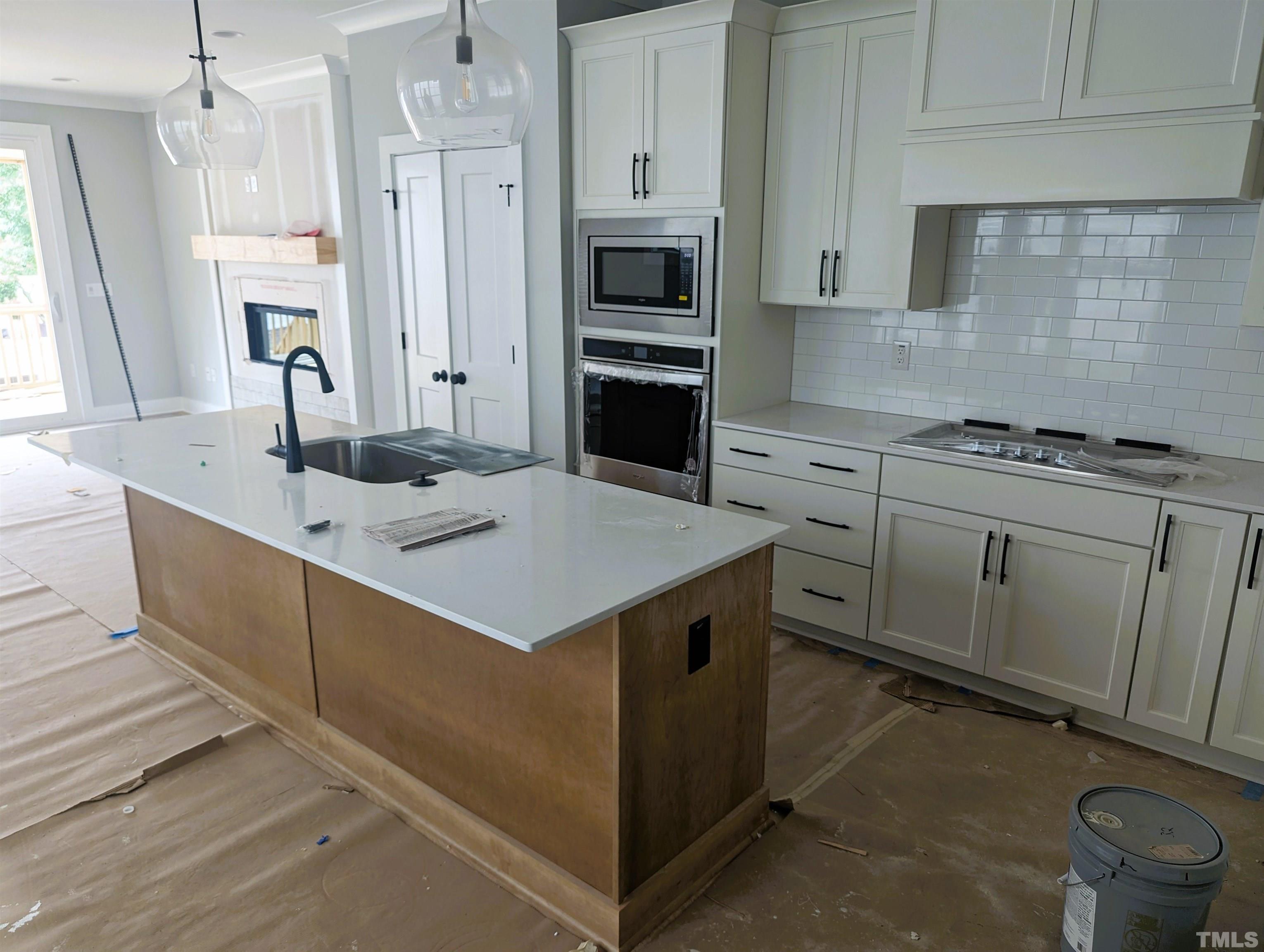 200 East Moore Street Apex, NC 27502 - Photo 2 of 19 a kitchen with a sink stove and refrigerator