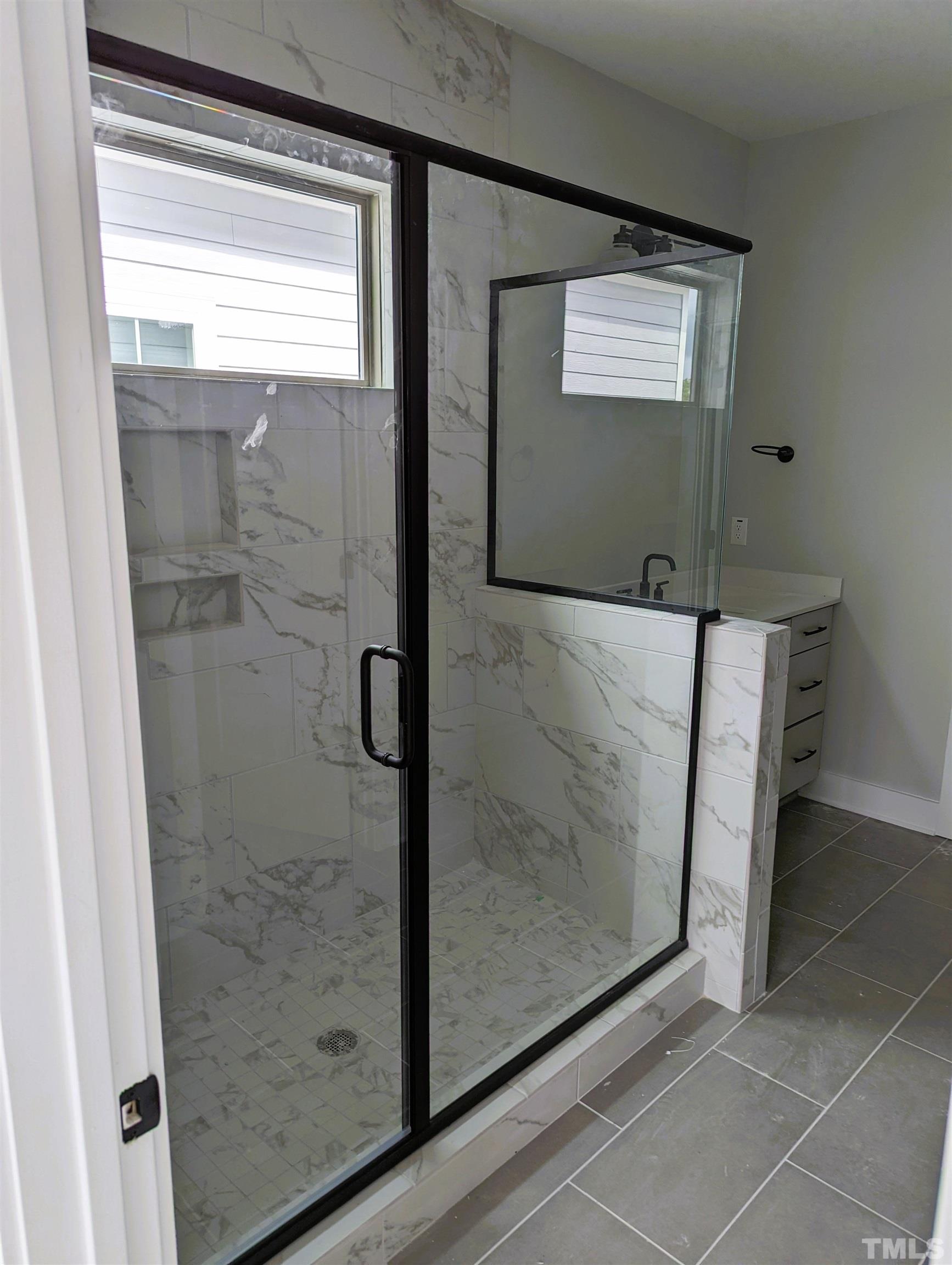 200 East Moore Street Apex, NC 27502 - Photo 7 of 19 a bathroom with a bathtub