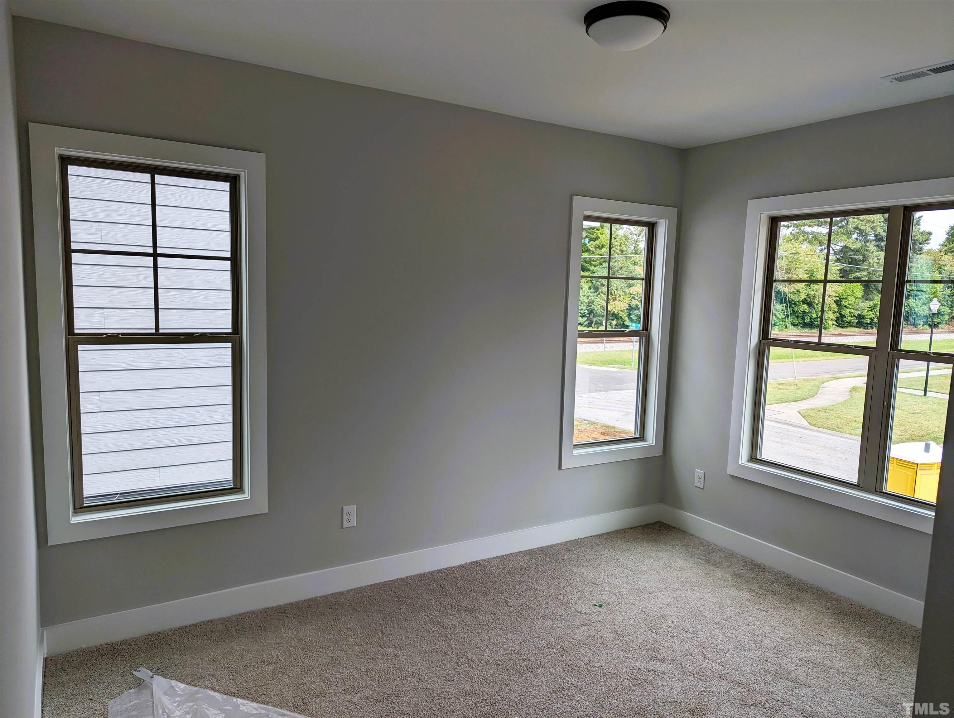 200 East Moore Street Apex, NC 27502 - Photo 10 of 19 a view of an empty room with a window