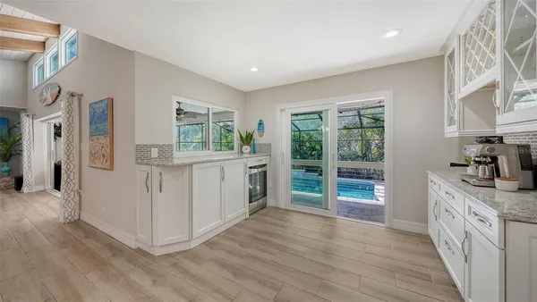 a room with wooden floor and window