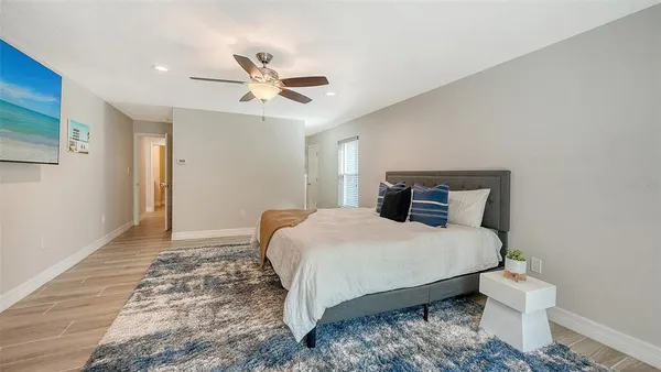 a bed room with a bed and a chandelier