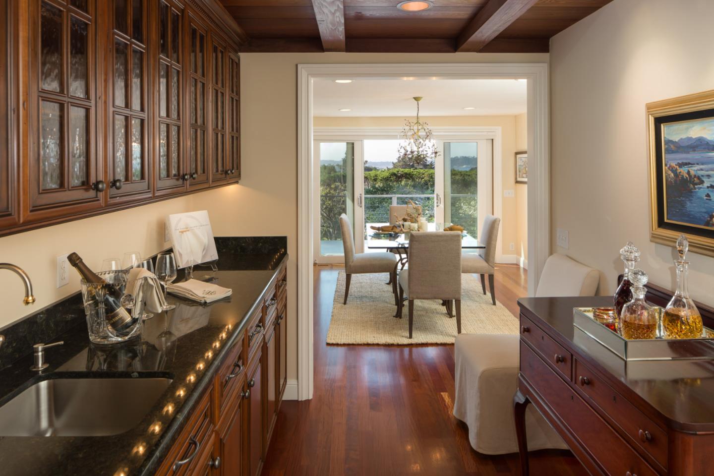 25840 Hatton Road Carmel, CA 93923 - Photo 15 of 43 a living room with furniture floor to ceiling window and wooden floor