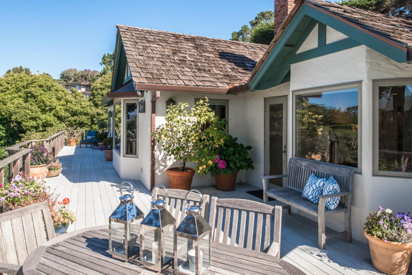 25840 Hatton Road Carmel, CA 93923 - Photo 2 of 43 a view of a patio with couches table and chairs and potted plants