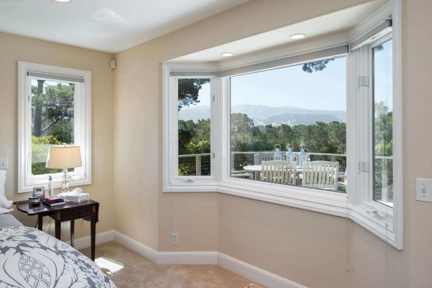 25840 Hatton Road Carmel, CA 93923 - Photo 24 of 43 a view of a bedroom with a bed and wooden floor