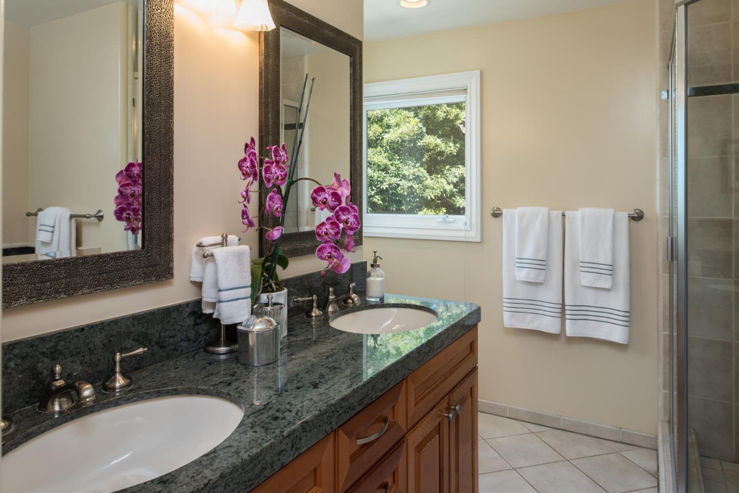25840 Hatton Road Carmel, CA 93923 - Photo 31 of 43 a bathroom with a granite countertop sink and a mirror