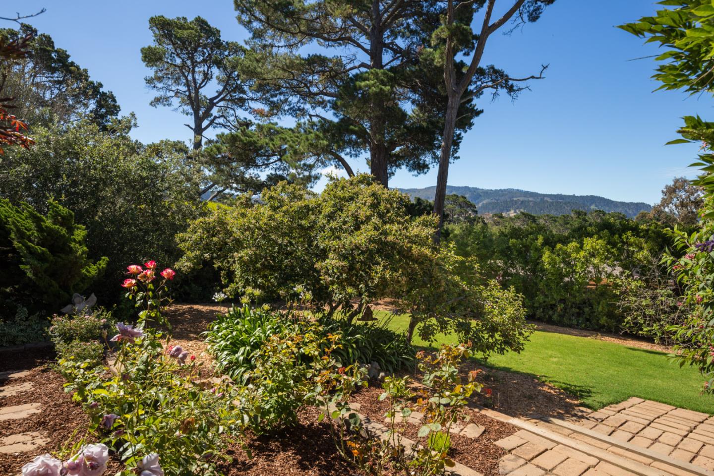 25840 Hatton Road Carmel, CA 93923 - Photo 36 of 43 a view of a house with a yard and garden