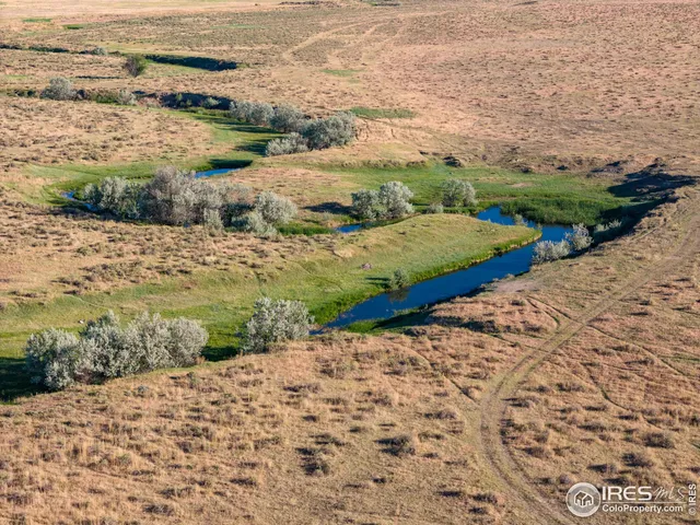 a view of an ocean beach and mountain