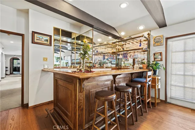 a house view with swimming pool in front of it