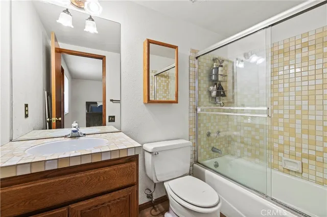 a view of a patio with table and chairs and potted plants