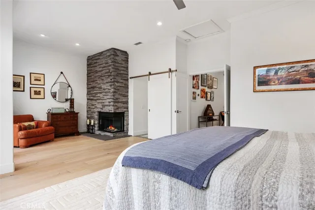 a spacious bedroom with a bed and a couch