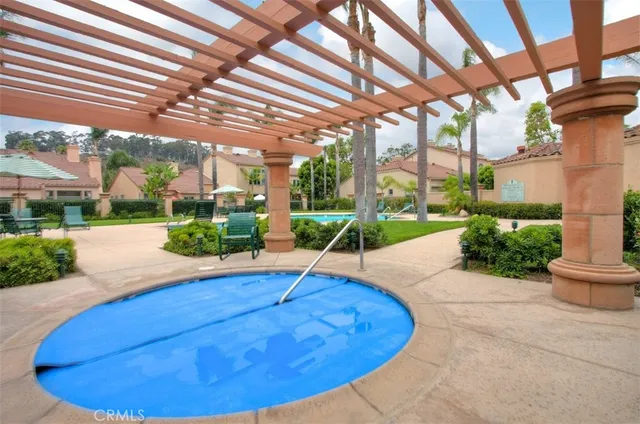 a view of swimming pool with chairs