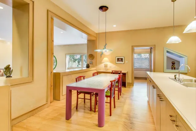 a living room with furniture cabinets and a book shelf