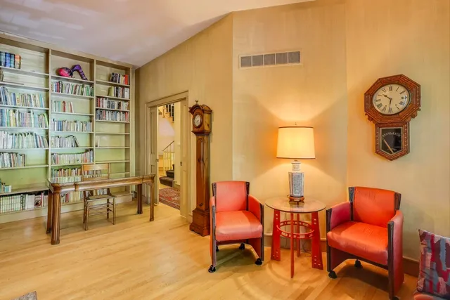 a spacious bedroom with a bed and a chandelier