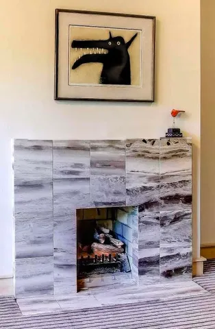 a bathroom with a sink mirror and shower