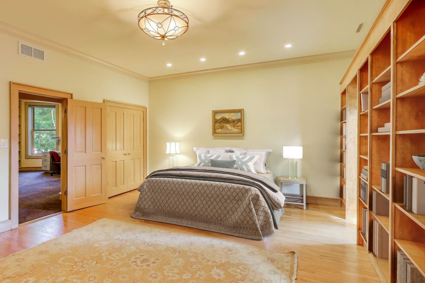 907-909 West Webster Avenue Chicago, IL 60614 - Photo 32 of 71 a spacious bedroom with a bed and a chandelier