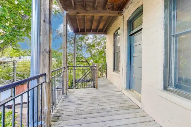 a view of a dining room with a table and chairs