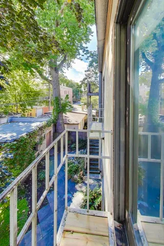 a living room with furniture a couch and a flat screen tv