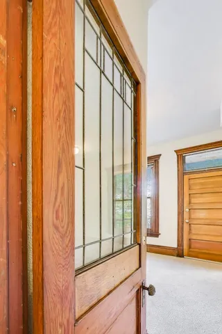 a view of a patio with table and chairs and potted plants