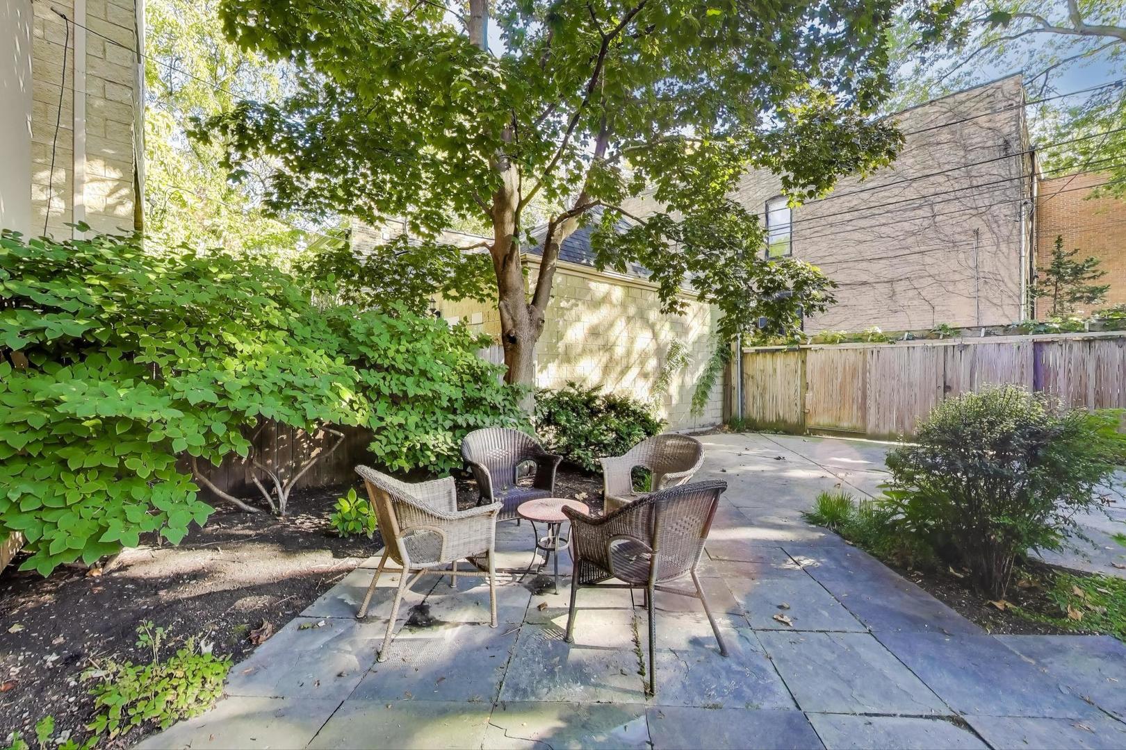 907-909 West Webster Avenue Chicago, IL 60614 - Photo 56 of 71 a view of a backyard with sitting area and furniture
