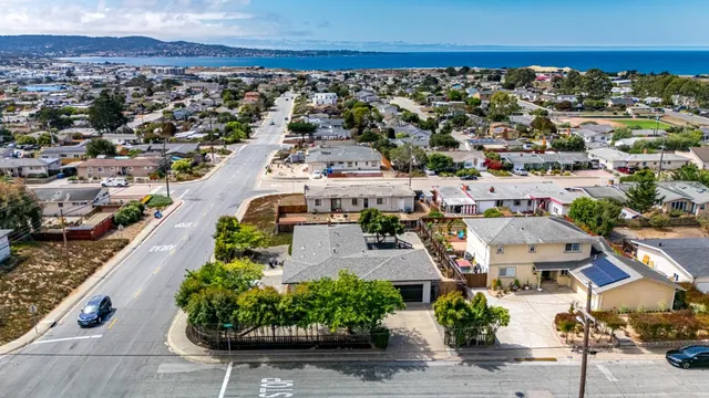 an aerial view of residential houses with outdoor space