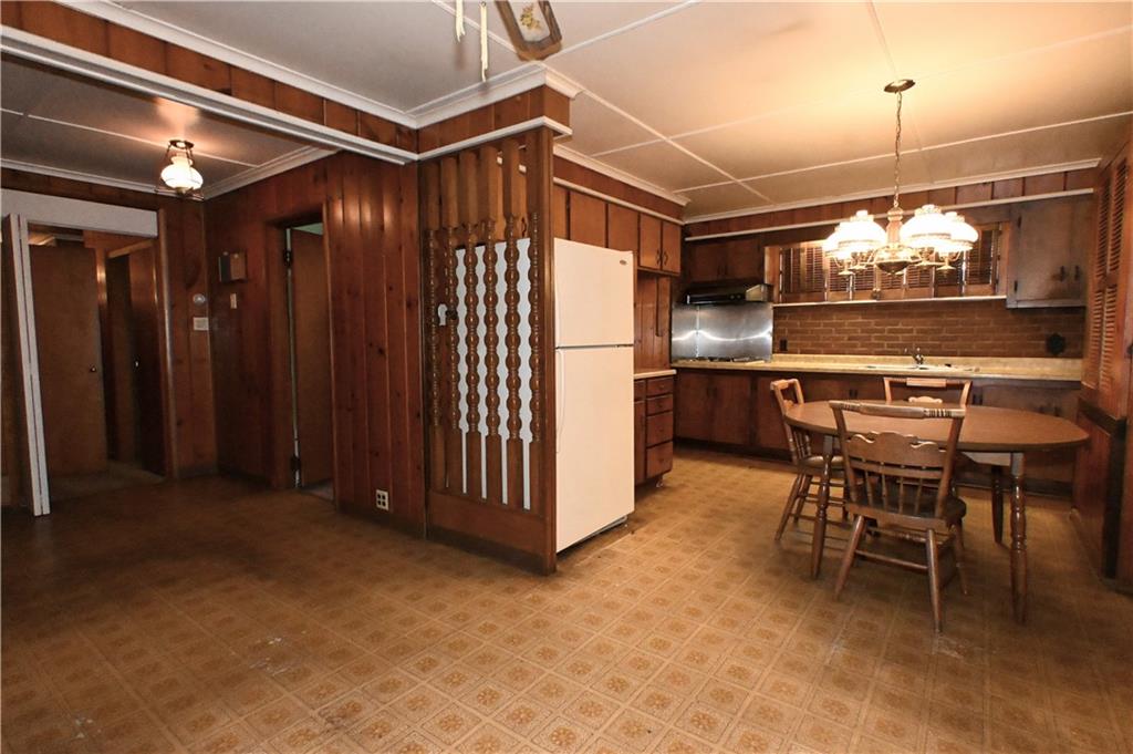 122 Taylor Run Road Monongahela, PA 15063 - Photo 21 of 31 a room with stainless steel appliances kitchen island a table and chairs in it