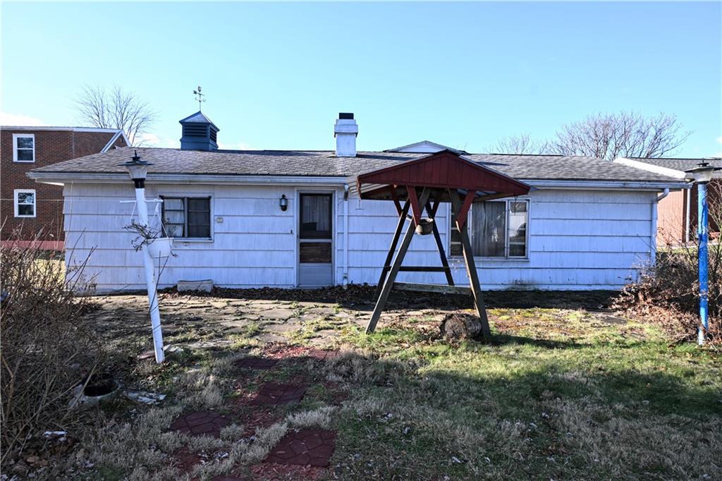 122 Taylor Run Road Monongahela, PA 15063 - Photo 28 of 31 a view of a backyard with table and chairs under an umbrella