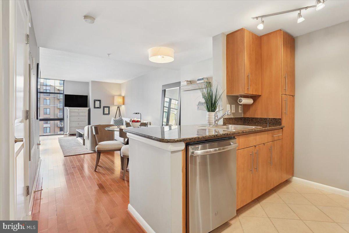a kitchen with stainless steel appliances granite countertop a stove and a refrigerator