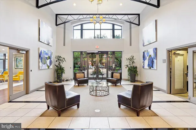 a living room with fireplace furniture and a window