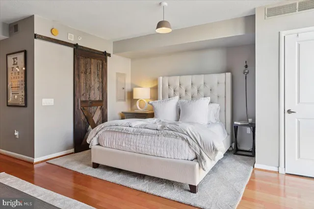 a spacious bedroom with a bed and a walk in closet