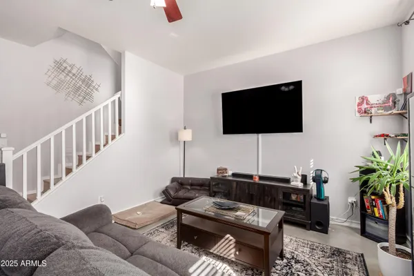 a living room with furniture and a flat screen tv