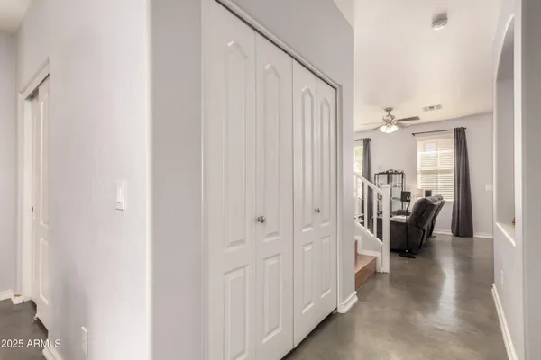 a view of a hallway with living room and furniture