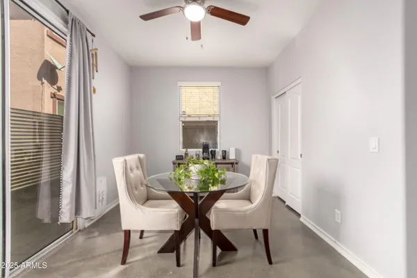 a view of a dining room with furniture and window