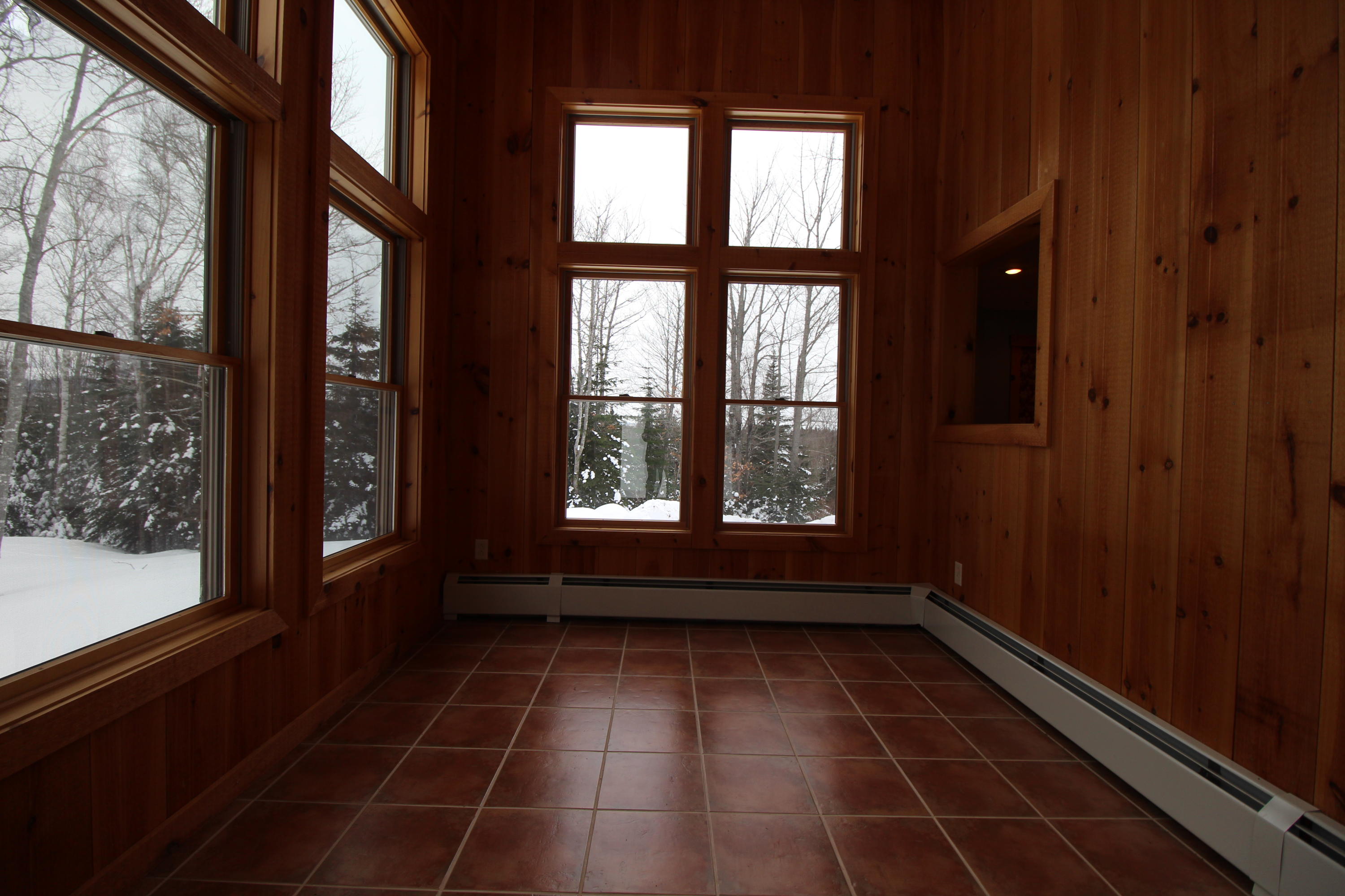 68 Harold Ross Road Dallas Plt, ME 04970 - Photo 11 of 37 cozy sunroom