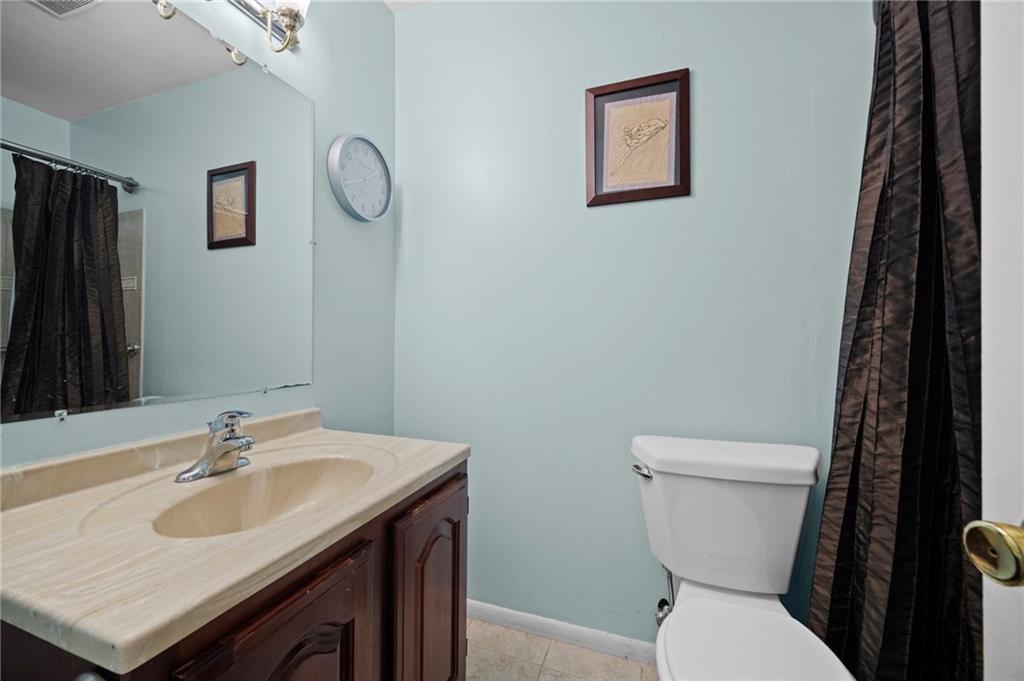 1213 Corrin Avenue Monongahela, PA 15063 - Photo 14 of 41 a bathroom with a sink toilet and a mirror