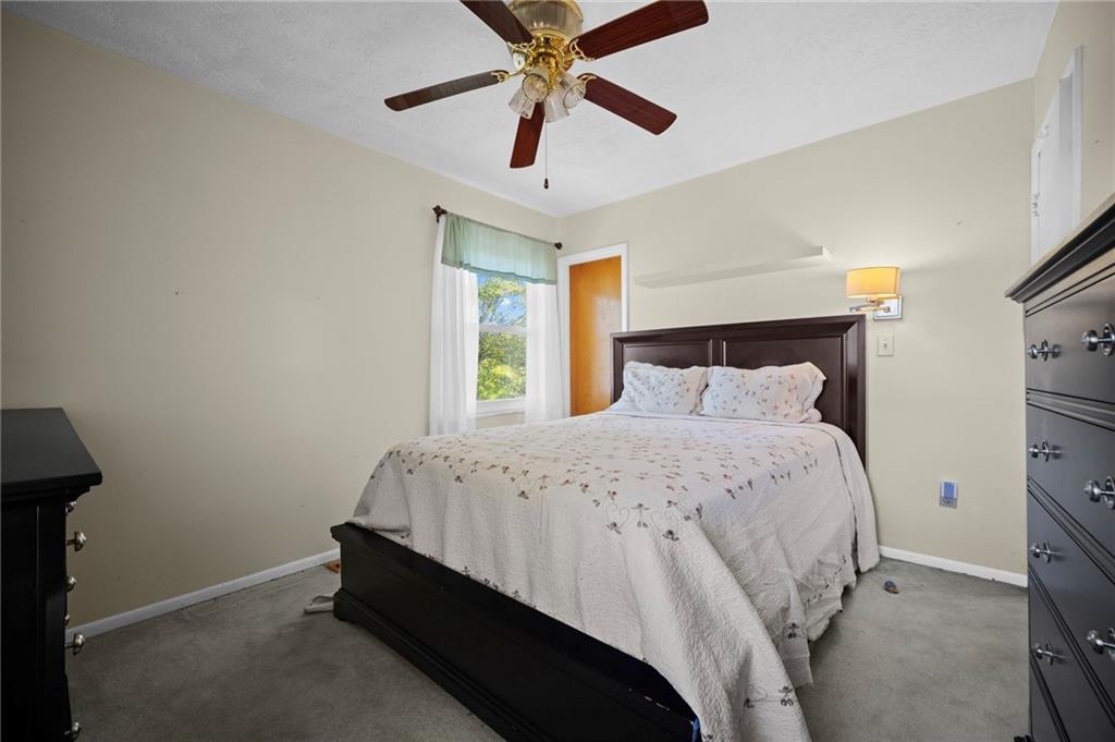 1213 Corrin Avenue Monongahela, PA 15063 - Photo 17 of 41 a bedroom with a bed and a ceiling fan