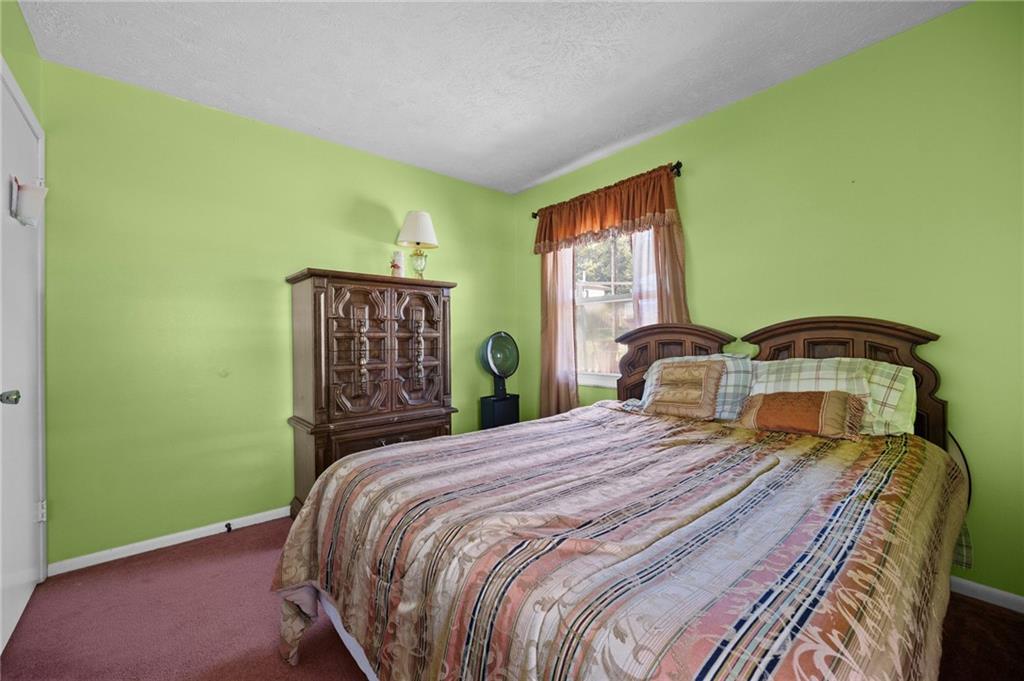 1213 Corrin Avenue Monongahela, PA 15063 - Photo 19 of 41 a bedroom with a bed and wooden floor