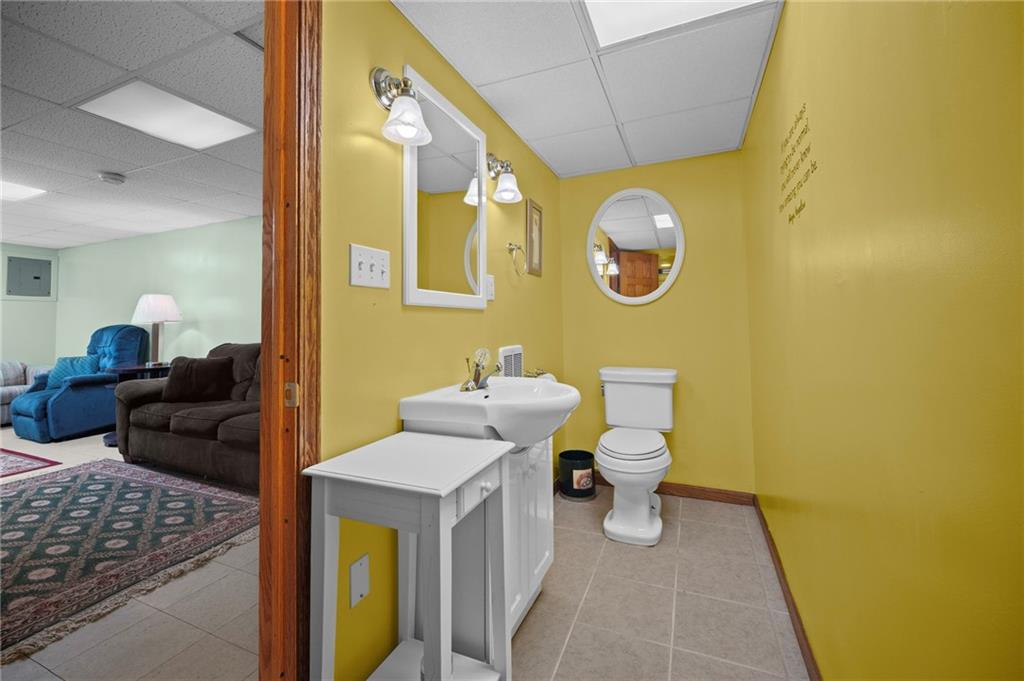 1213 Corrin Avenue Monongahela, PA 15063 - Photo 27 of 41 a bathroom with a toilet and a mirror