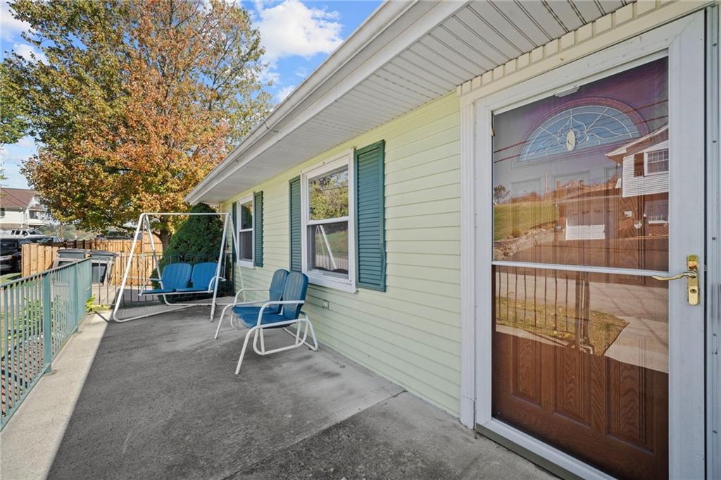 1213 Corrin Avenue Monongahela, PA 15063 - Photo 31 of 41 a view of a chair and table in the back yard of the house