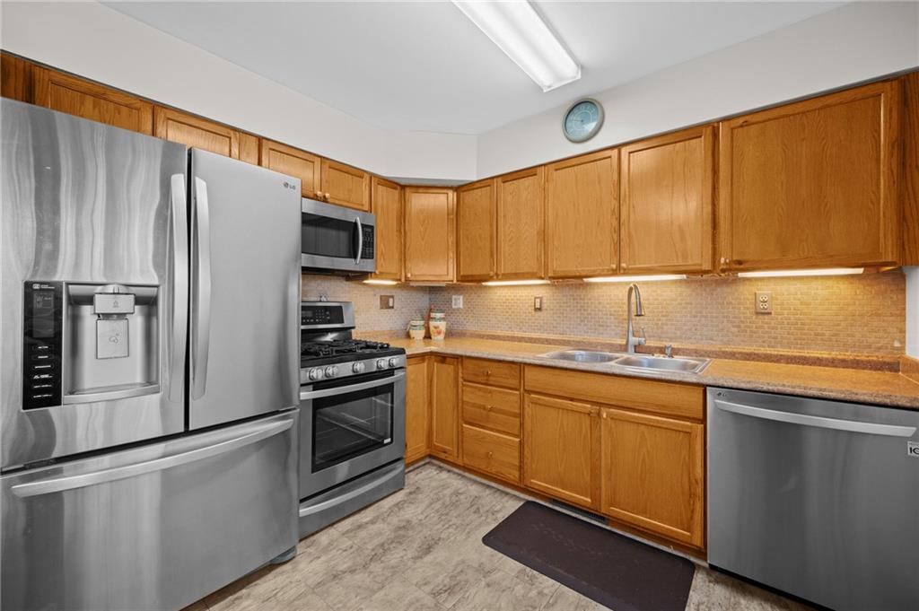 1213 Corrin Avenue Monongahela, PA 15063 - Photo 6 of 41 a kitchen with stainless steel appliances granite countertop a refrigerator sink and stove