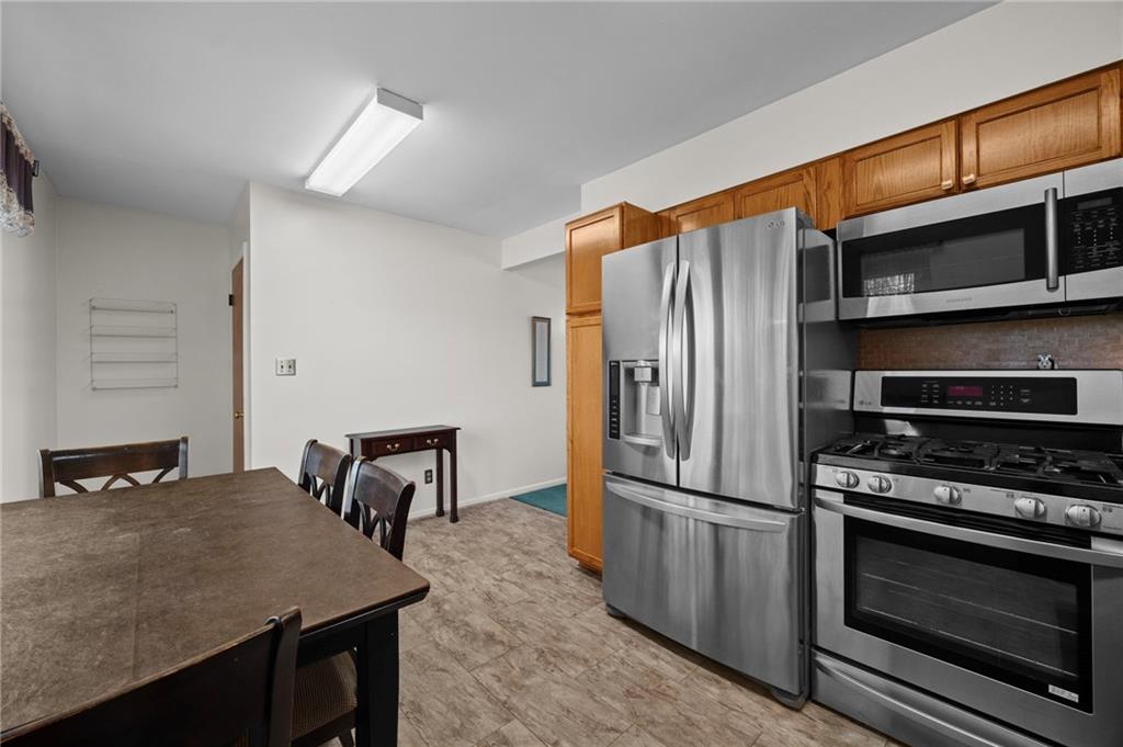 1213 Corrin Avenue Monongahela, PA 15063 - Photo 8 of 41 a kitchen with kitchen island a stove and a refrigerator