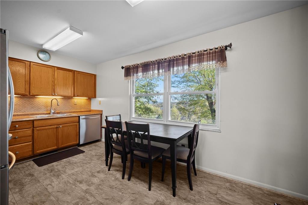 1213 Corrin Avenue Monongahela, PA 15063 - Photo 10 of 41 a kitchen with a table and chairs in it