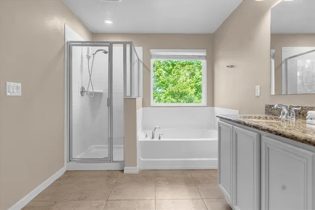 a bathroom with a bathtub and a sink