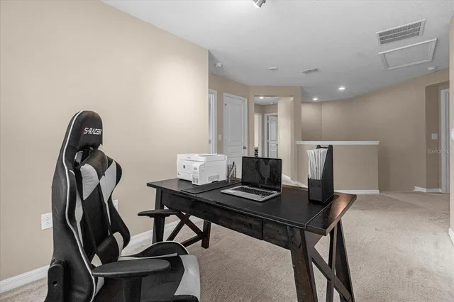 a view of a workspace with furniture